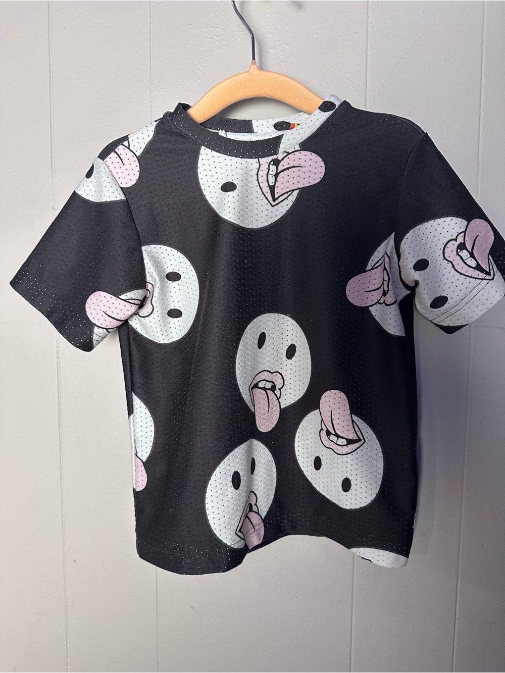 Caroline Bosmans Black Tee with White Emoji Faces and Pink Tongues
